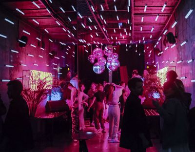 Private event package in South Metro Denver curated by SideQuest Events with people dancing in party venue