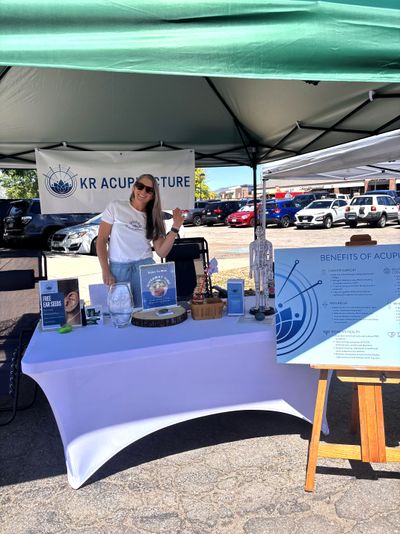 Acupuncturist vendor tent at Coal Mine Spring Festival in Littleton, CO