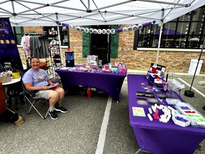 Homemade crafts vendor tent in Denver, CO at a SideQuest Events festival